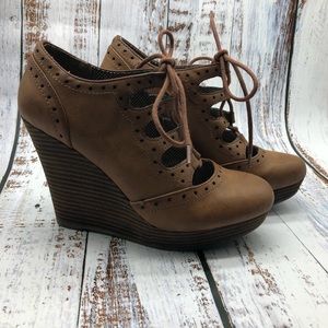 Restricted leather lace up platform wedges